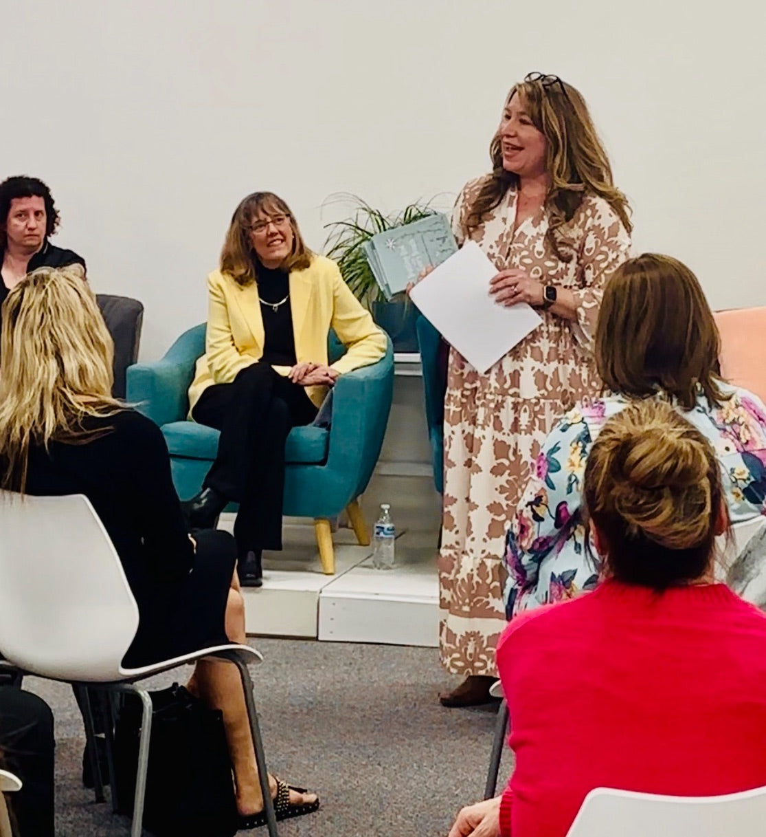 Amy Mecham speaking to a group of women